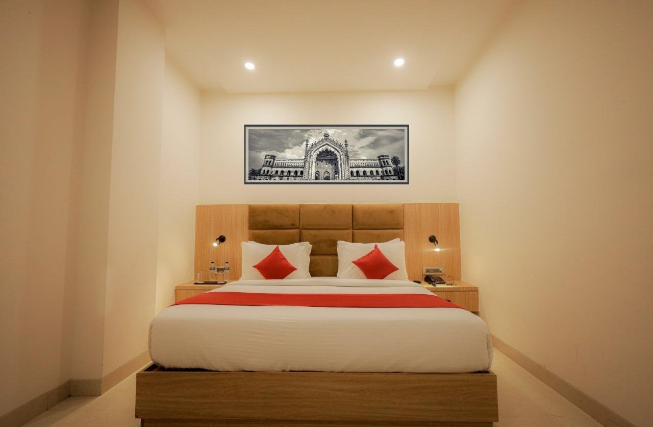 The Royal Legacy Deluxe Room with King Bed, Wall Art and Bedside Sconces